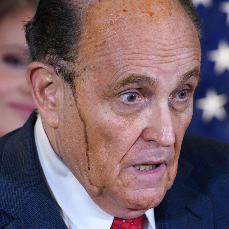 Rudy Giuliani during his very sweaty press conference. Picture: MANDEL NGAN / AFP)