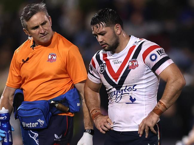 PENRITH, AUSTRALIA - MAY 12:  Brandon Smith of the Roosters is attended to by a trainer during the round 11 NRL match between the Penrith Panthers and Sydney Roosters at BlueBet Stadium on May 12, 2023 in Penrith, Australia. (Photo by Mark Kolbe/Getty Images)