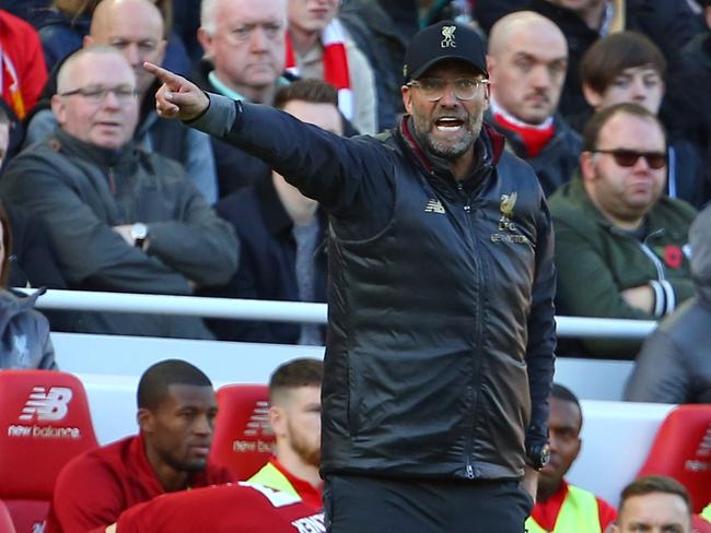 Liverpool's German manager Jurgen Klopp gestures on the touchline during the English Premier League football match between Liverpool and Fulham at Anfield in Liverpool, north west England on November 11, 2018. (Photo by Geoff CADDICK / AFP) / RESTRICTED TO EDITORIAL USE. No use with unauthorized audio, video, data, fixture lists, club/league logos or 'live' services. Online in-match use limited to 120 images. An additional 40 images may be used in extra time. No video emulation. Social media in-match use limited to 120 images. An additional 40 images may be used in extra time. No use in betting publications, games or single club/league/player publications. /