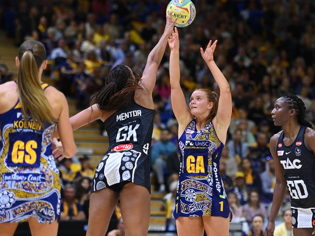 Mentor trying her utmost to stop Steph Wood at University of Sunshine Coast Stadium. Picture: Albert Perez/Getty Images