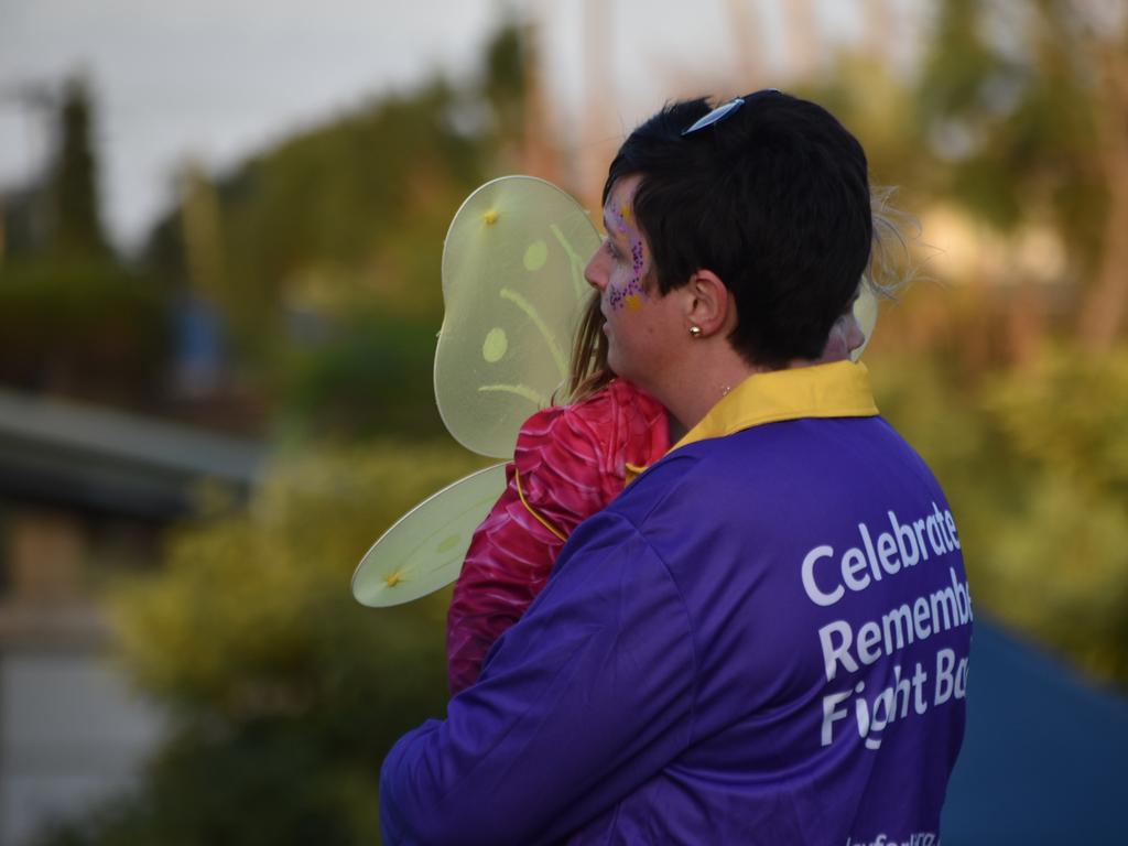 Alicia Jensen carrying Emily at the Mackay Pioneer Valley Relay For Life, September 2021. Picture: Lillian Watkins