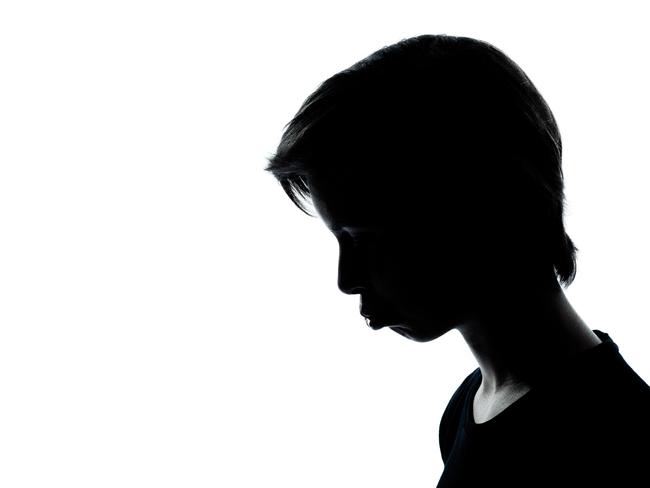 one young teenager boy or girl silhouette moody pouting sad