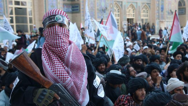 Talian security personnel stand guard during a protest against the assassination of Hamas chief Ismail Haniyeh, at the Jami mosque in Herat, on August 7.