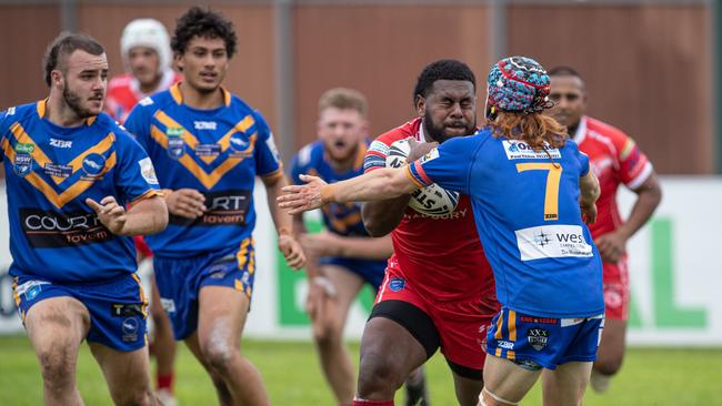 Rupeni Geke on the charge for the Eagles against City halfback Tyrone Tsagalias. Pics by Julian Andrews.