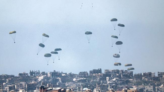 Humanitarian aid is airdropped over the Gaza Strip on Wednesday. Picture: AFP