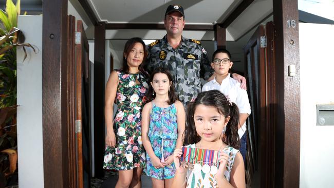 Commanding Officer of HMAS Cairns Commander Glenn Williams with his family Veronica, Scarlett, 8, Lucy, 6, and Stuart, 11, at their Smithfield front gate to promote the ANZAC Day driveway Dawn Service in 2020. Picture: Stewart McLean