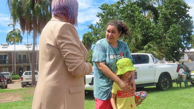 Children and Families Minister Robyn Cahill speaking to local resident Jeraldine Tyson and her five-year old son, Eli. Picture: Harry Brill.