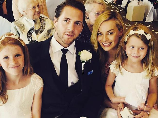 Not their wedding, but certainly preparation? Tom Ackerley and Margot Robbie.