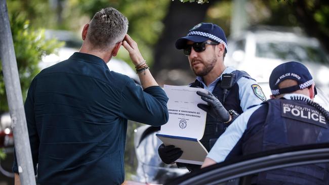 This man tested positive for meth and was seen crying afterwards in the back of the police car. Picture: Sam Ruttyn