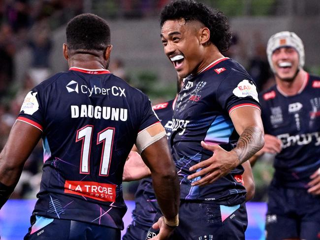Rebels players celebrate a try scored by Filipo Daugunu (L) during the Super Rugby match between the Melbourne Rebels and the Western Force in Melbourne on March 1, 2024. (Photo by William WEST / AFP) / --IMAGE RESTRICTED TO EDITORIAL USE - STRICTLY NO COMMERCIAL USE--