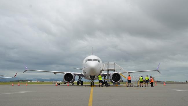 Bonza's first Sunshine Coast-Townsville flight landed under some dark clouds – but it was all smiles from the first-ever passengers.