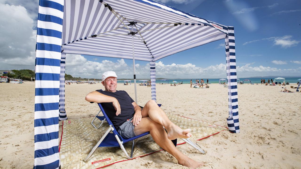 QLD architect Mark Fraser who created the Cool Cabana beach umbrella on Noosa Main Beach. Picture: Lachie Millard