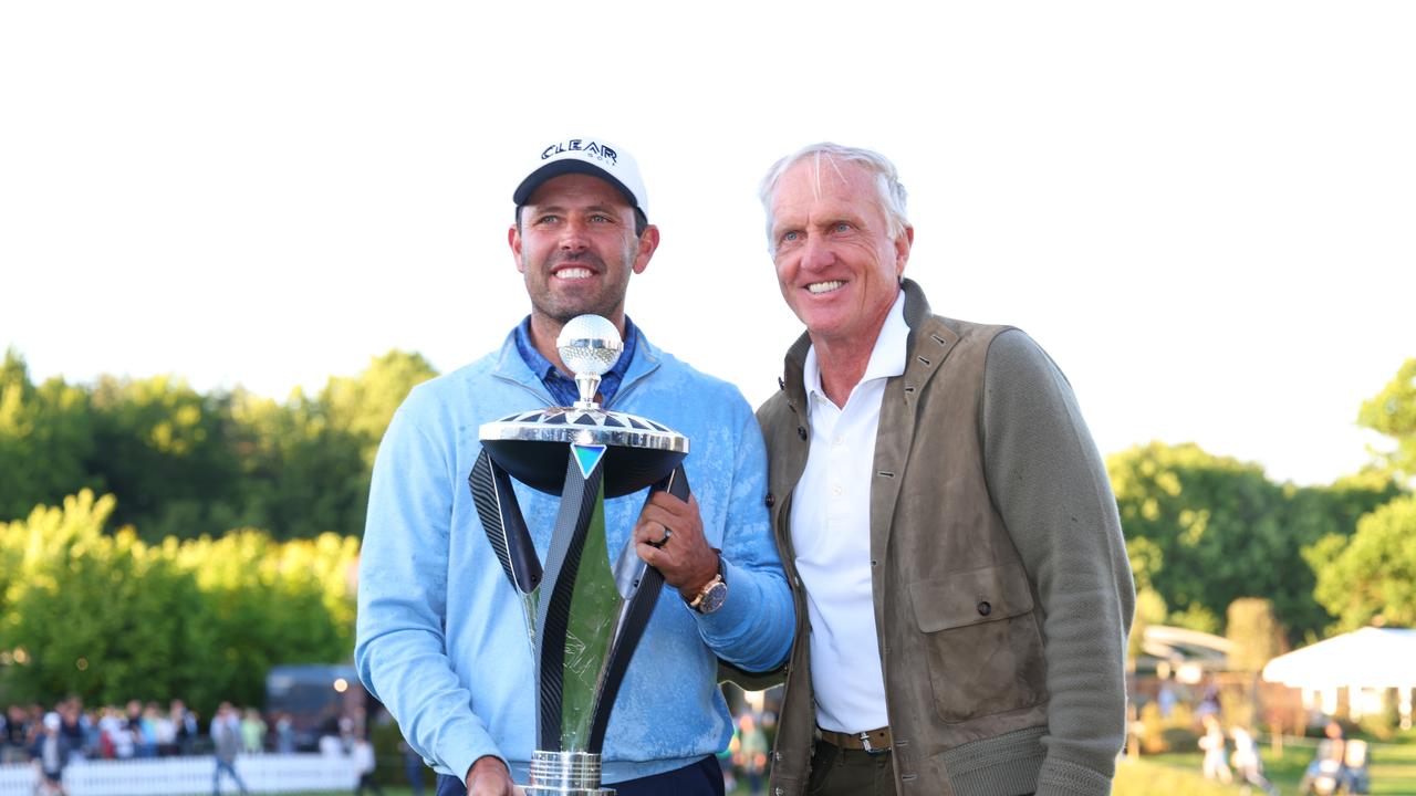 ST ALBANS, ENGLAND - JUNE 11: Charl Schwartzel of Stinger GC poses alongside Greg Norman with the LIV Golf Invitational trophy following day three of LIV Golf Invitational - London at The Centurion Club on June 11, 2022 in St Albans, England. (Photo by Chris Trotman/LIV Golf/Getty Images)