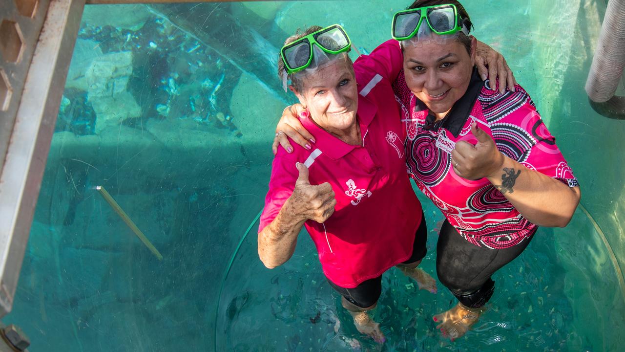 Breast cancer survivor Glenda Reid and BreastScreen NT representative Natalie Stokes entering the cage of death at the Crocosaurus Cove, Darwin. Picture: Pema Tamang Pakhrin