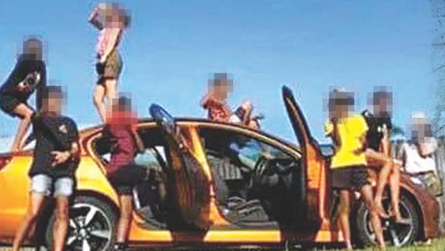 Cairns youths pose with stolen car in March.