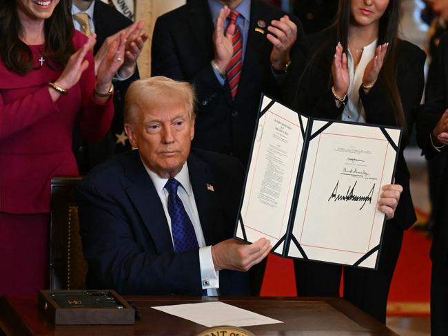 US President Donald Trump poses after signing the Laken Riley Act, which mandates the detention of undocumented immigrants charged with theft-related crimes and is named for the 22-year-old student murdered by a Venezuelan man. Picture: AFP