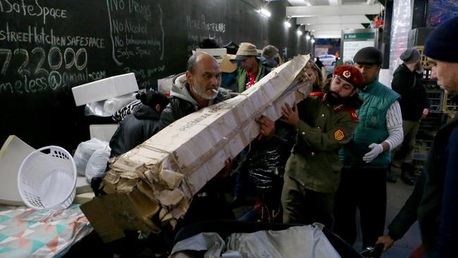 Lanz Priestley moves items. Homeless relocation in Martin Place on June 24, 2017 in Sydney, Australia. Picture: Jason McCawley.