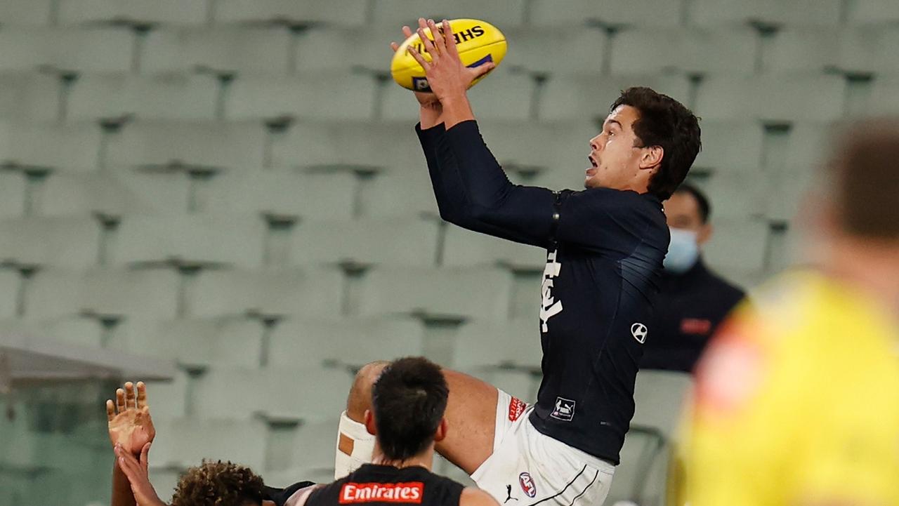 Jack Silvagni takes a spectacular mark over Isaac Quaynor. Picture: Michael Willson/AFL Photos