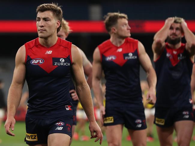 MELBOURNE, AUSTRALIA - JULY 05: The Demons look dejected following defeat in the round 5 AFL match between the Melbourne Demons and the Richmond Tigers at Melbourne Cricket Ground on July 05, 2020 in Melbourne, Australia. (Photo by Graham Denholm/AFL Photos via Getty Images)