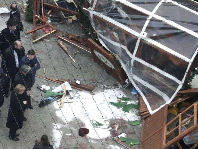 German Chancellor Angela Merkel, bottom left, visits the site of the attack in Berlin, Germany. Picture: AP Photo/Markus Schreiber