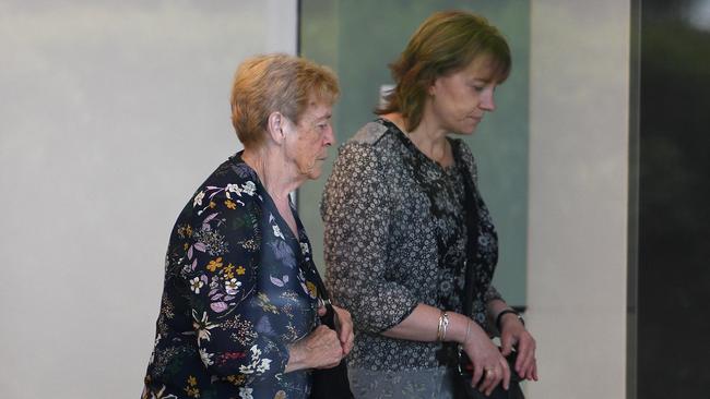 Angela Gore, left, arrives at the NSW State Coroner’s Court at Lidcombe in Sydney.