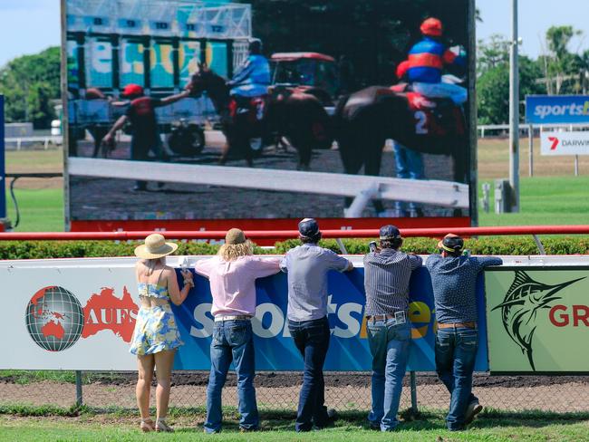 Punters take in the action at the Adelaide River Cup Day at the Fannie Bay Turf Club. Picture: Glenn Campbell