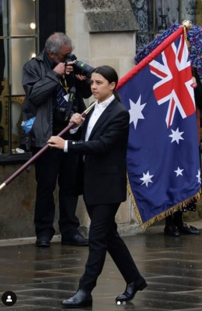 Sam Kerr carries the flag for Australia at the Kings Coronation today. Picture: Instagram