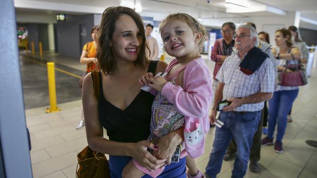 Nancy Prospero, from Prestons, with her three-year-old daughter, Alexia, managed to stay all smiles at Sydney Airport despite soaring parking fees. Picture: Justin Lloyd