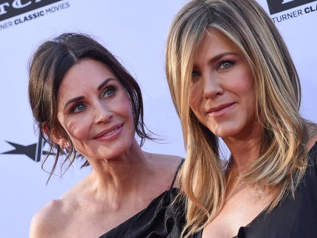 (FILES) In this file photo taken on June 7, 2018 US actresses Courteney Cox (L) and Jennifer Aniston attends the 46th American Film Institute Life Achievement Award Gala at the Dolby Theatre in Hollywood. - Emmy nominations were announced on July 13, 2021 as television prepares to honor a year transformed by the pandemic. Courteney Cox was famously the one "Friends" star never nominated for an Emmy during the wildly popular sitcom's original run. Voters finally remedied that -- to an extent -- that by nominating the much-maligned "Friends: The Reunion," on which Cox served as an executive producer, for four awards including best pre-recorded variety special. (Photo by VALERIE MACON / AFP)