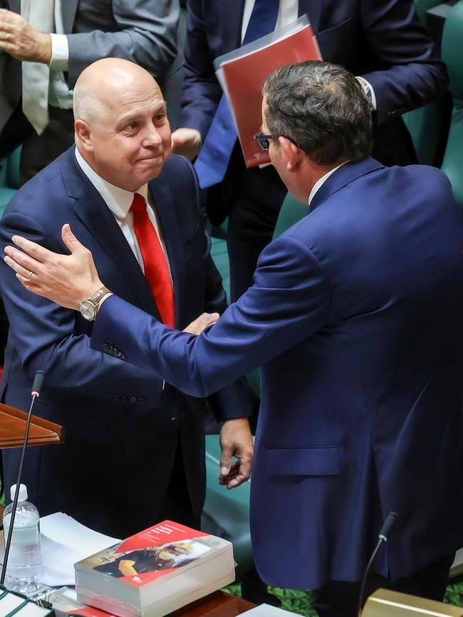 Victorian Treasurer Tim Pallas is congratulated by Premier Dan Andrews after delivering the budget. Picture: Ian Currie