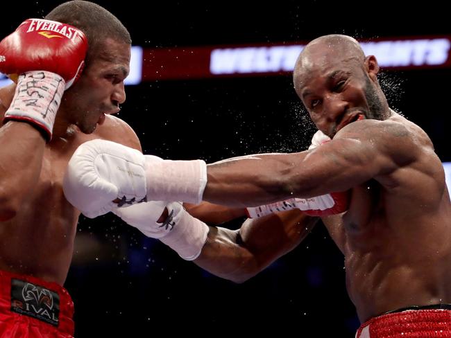 He copped some punishment, but Yordenis Ugas (right) proved too good for Thomas Dulorme (left).