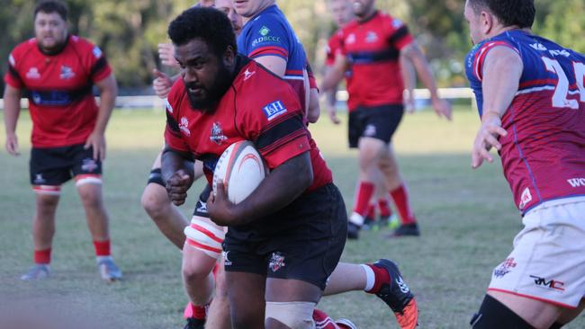 Gold Coast District Rugby Union (GCDRU) Round Six clash between Griffith Uni Colleges Knights (Red/Black) and Bond Pirates (Blue/Red) at Heeb St, Benowa. Lesi Semi carries. Pic Mike Batterham