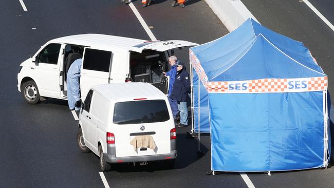 Mr Virgona’s van being examined by police on EastLink. Picture: David Crosling