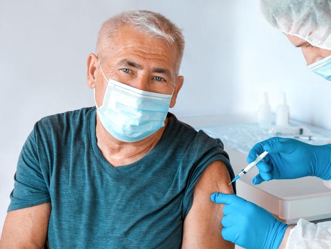 Senior People Vaccination. Elderly Man In Face Mask Getting Vaccinated. Doctor Giving Corona Virus Vaccine Injection Patient. Covid-19 Flu Protection. Mature Man In Clinic. Protection of Seniors. Elderly Man feeling Good on getting Vaccine from Coronavirus. Covid Vaccination for Older People. Senior Man showing her Arm. Picture: Istock