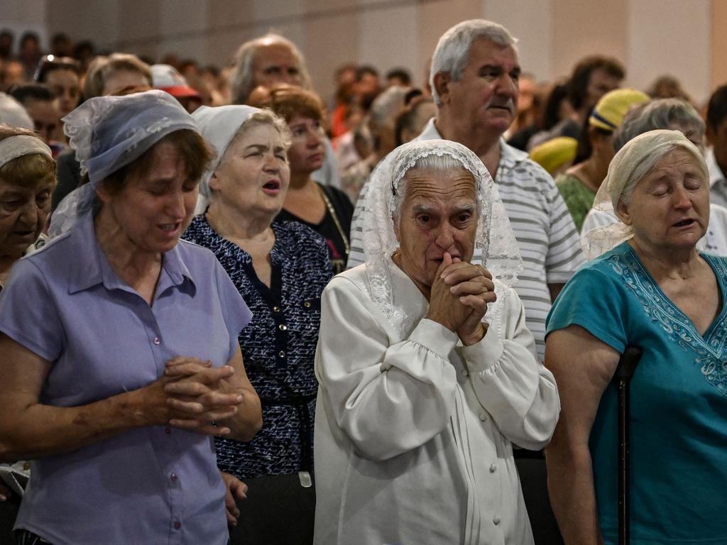 Members of the congregation pray as they attend a Sunday service at a Christian Protestant Church in Kramatorsk, in the eastern Ukrainian region of Donbas. Picture: AFP