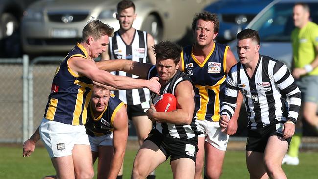 Jesse Davies pushes off Rupertswood’s Lachie Muir earlier this season. Picture: Hamish Blair