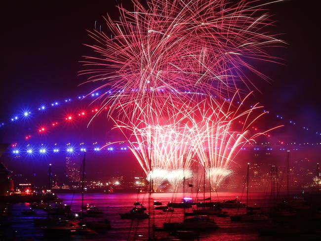 The harbour bridge lights up for the family fireworks. Picture Rohan Kelly