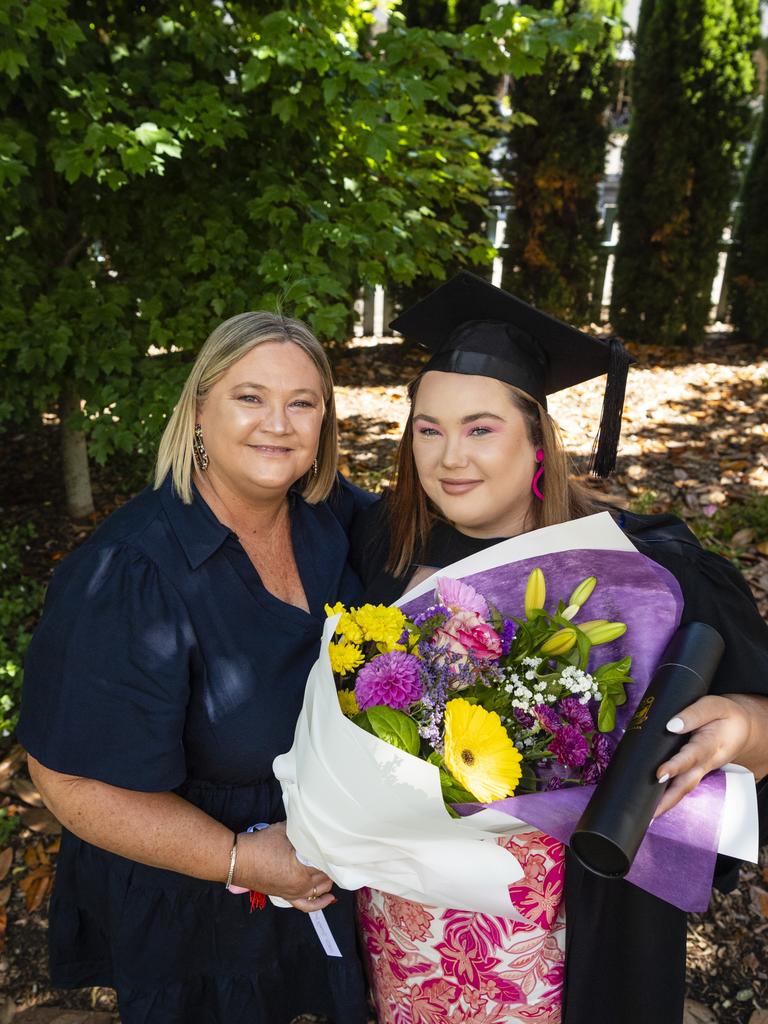 Rebecca Ketelhohn congratulates her daughter Amy Ketelhohn on completing her Bachelor of Paramedicine at the UniSQ graduation ceremony at Empire Theatres, Wednesday, December 14, 2022.