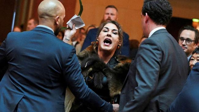 Senator Lidia Thorpe is removed for interrupting a Welcome to Country ceremony for King Charles at Parliament House with her own tirade against the monarchy. Picture: Reuters