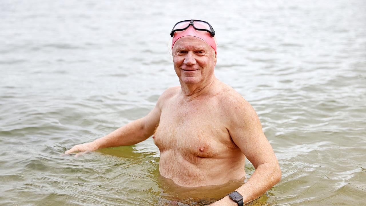 John leads a group of more than 100 ocean swimmers in Manly. Picture: Tim Hunter