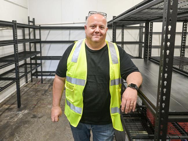 NOVEMBER 14, 2022: A notice in Coles at Dario Fontanarosa owner of Fine Food Cucina at Newton, standing in his empty fridge after having to dump thousands of dollars worth of food. Picture: Brenton Edwards