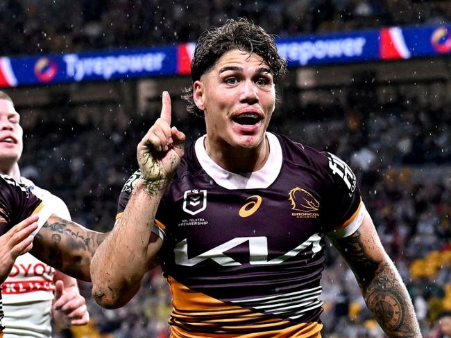 BRISBANE, AUSTRALIA - APRIL 20: Reece Walsh of the Broncos celebrates after scoring a try during the round seven NRL match between the Brisbane Broncos and Canberra Raiders at Suncorp Stadium, on April 20, 2024, in Brisbane, Australia. (Photo by Bradley Kanaris/Getty Images)