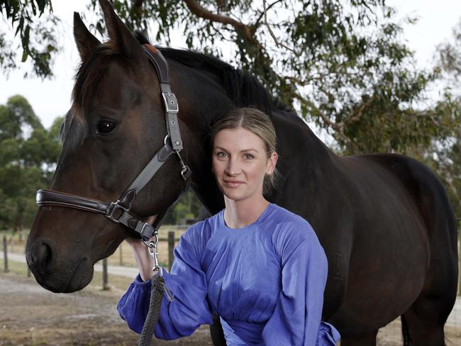 Jamie Kah says she has a whole new outlook on life after a horror two years. She is pictured with Brax, her ex racehorse formerly known as Rich Rupee at her property in Somerville. Picture: Michael Klein