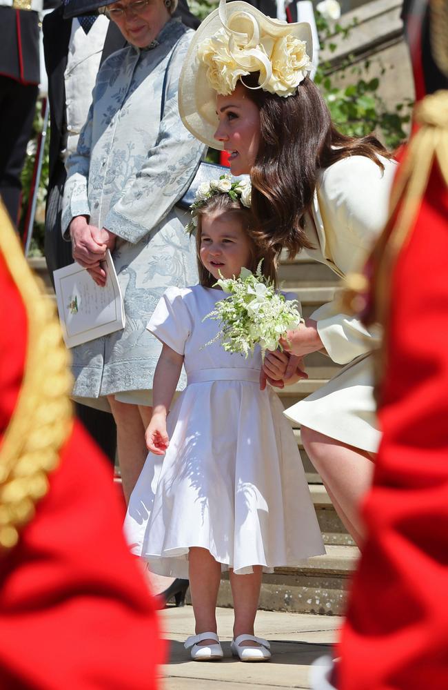 Prince Harry's niece and bridesmaid Princess Charlotte with her mother Britain's Catherine, Duchess of Cambridge. Picture: AFP