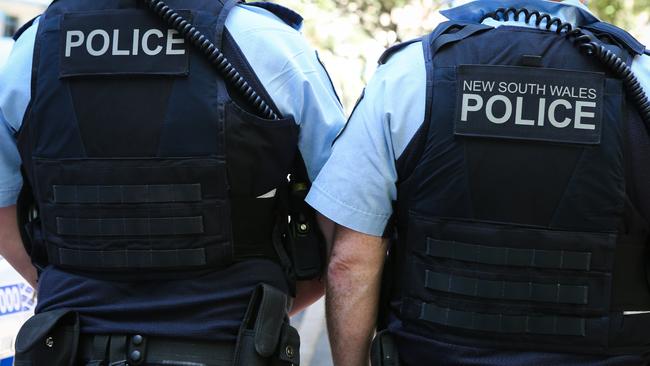 The man allegedly punched and kicked police officers, and bit one of them. Picture: NCA Newswire/Gaye Gerard