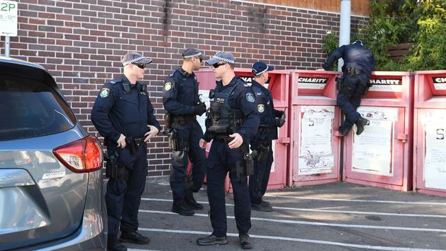 Police in the carpark of the Woolworths supermarket in Balmain after a boy was stabbed. Picture: AAP Image/Peter Rae