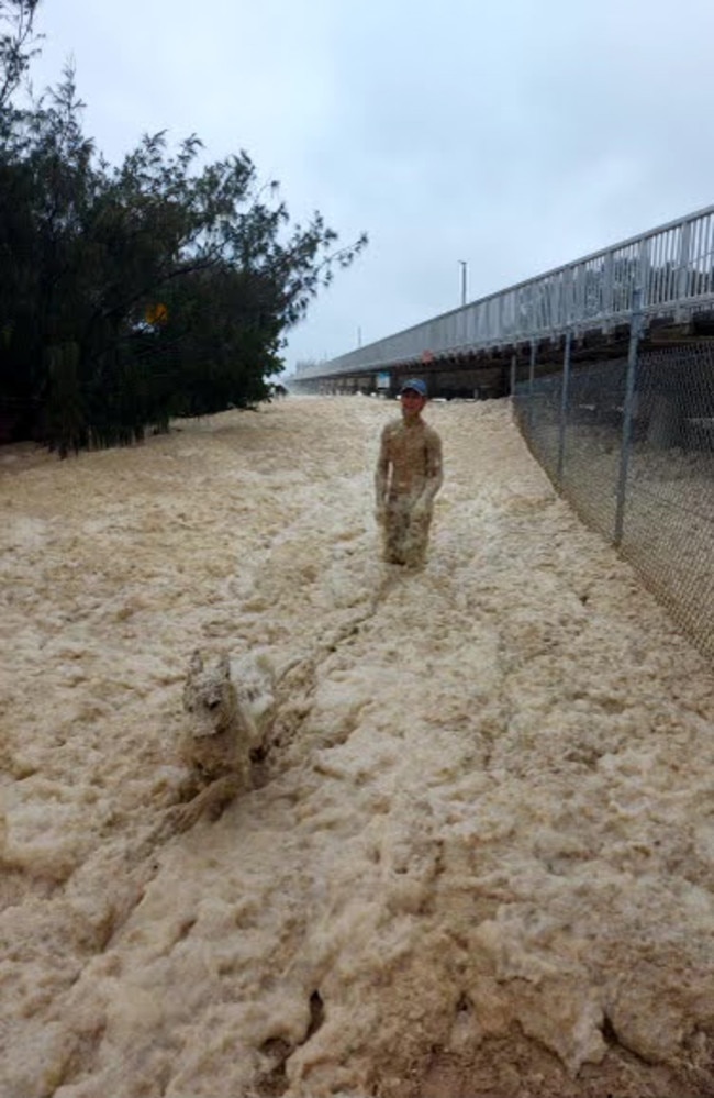 After about 15 minutes the man and his dog emerged covered in foam. Picture: Bryce Rogers