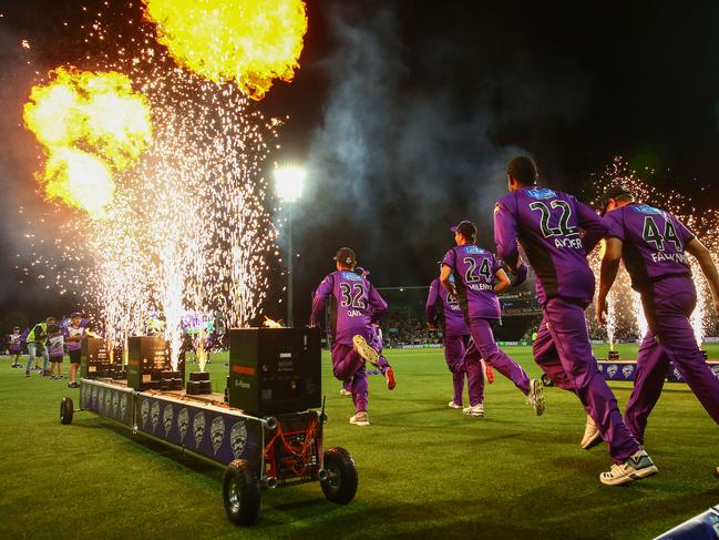 HOBART, AUSTRALIA - FEBRUARY 14: The Hurricanes run through flames onto the field during the Big Bash League semi final match between the Hobart Hurricanes and the Melbourne Stars at Blundstone Arena on February 14, 2019 in Hobart, Australia. (Photo by Scott Barbour/Getty Images)