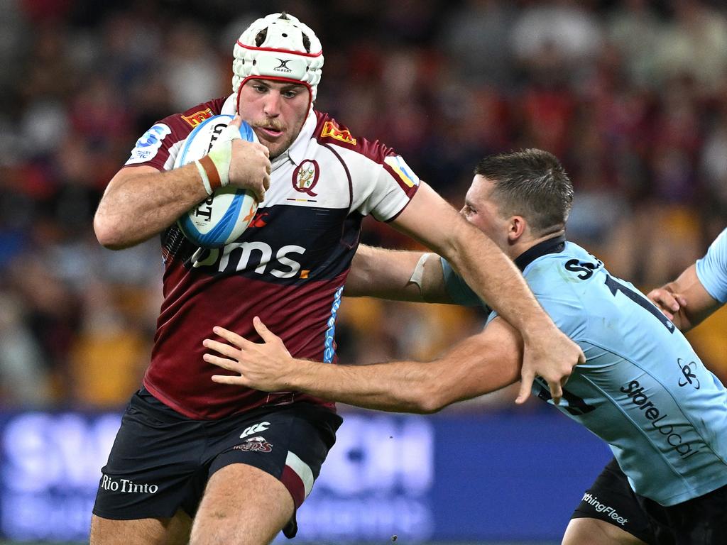 Reds star Fraser McReight beats a Waratahs defender. Picture: Getty Images