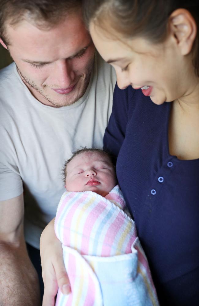 The new parents with their baby girl. Picture: Tim Hunter